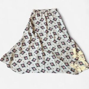 Tucker brand. 100% silk floral print maxi skirt with elastic waistband.